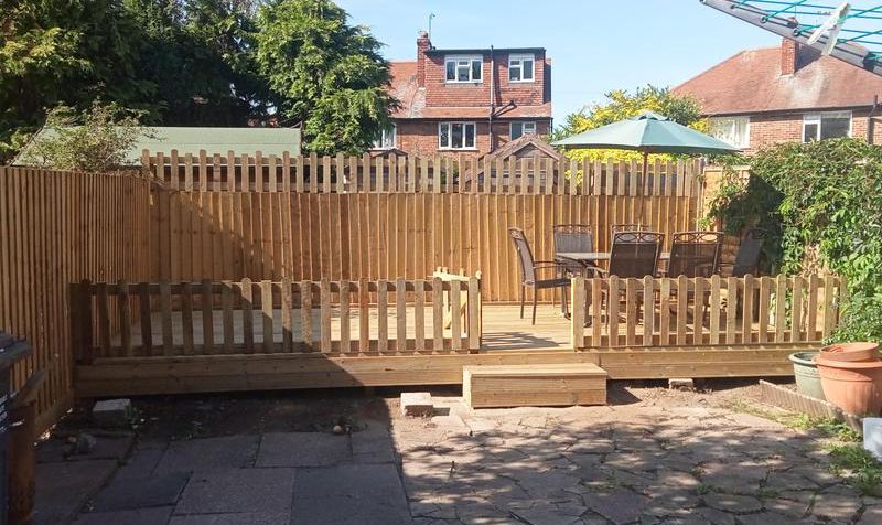 Picket fencing and gate around a new garden deck
